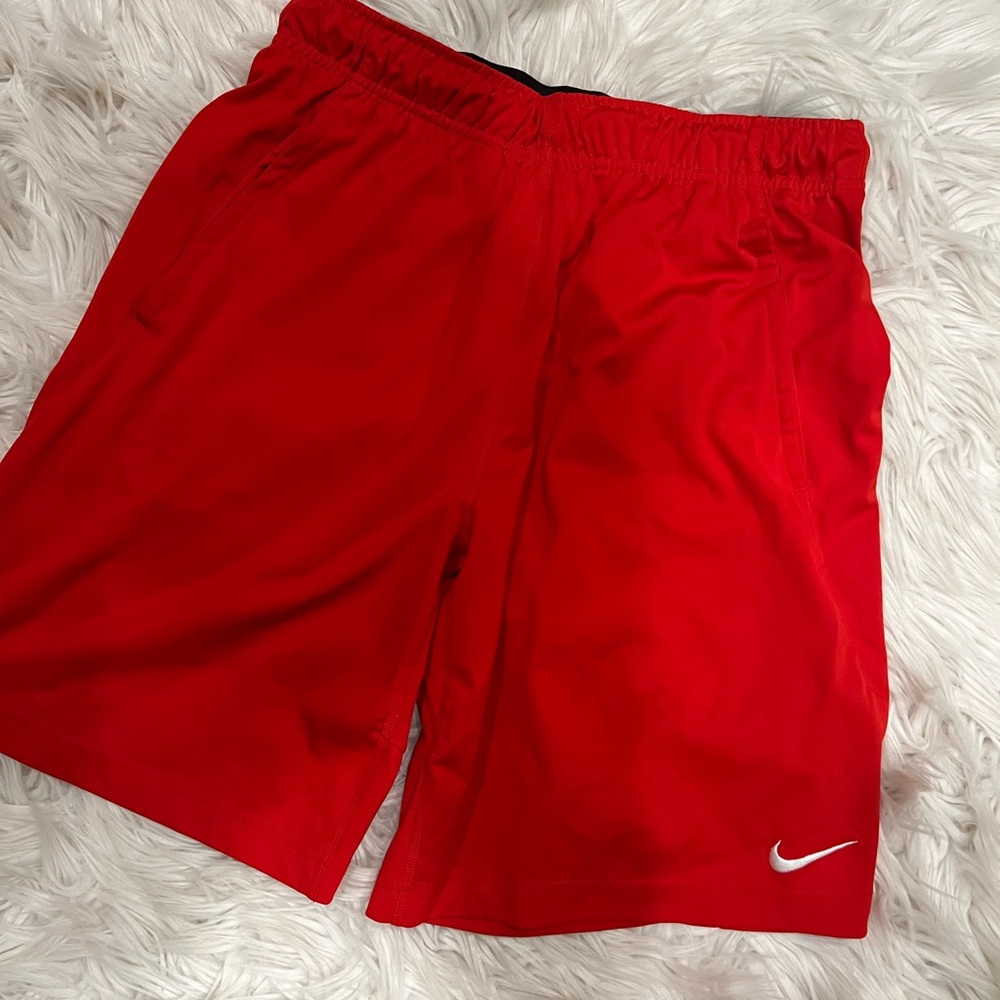 Red Nike shorts
